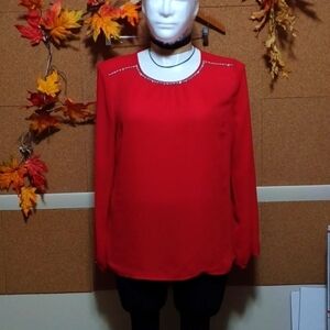 Beautiful red top size L in a rayon and nylon blend with a diamonds